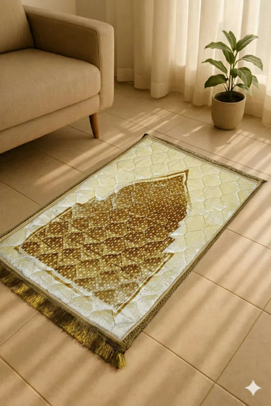 Beige and brown Islamic prayer mat with geometric patterns on tiled floor near beige sofa and green potted plant