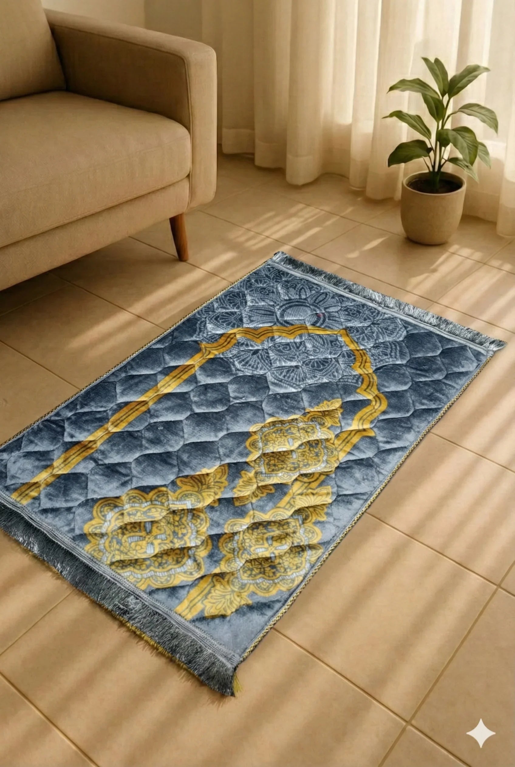 Blue and gold Islamic prayer mat laid on tiled floor near beige sofa and potted plant with sunlight