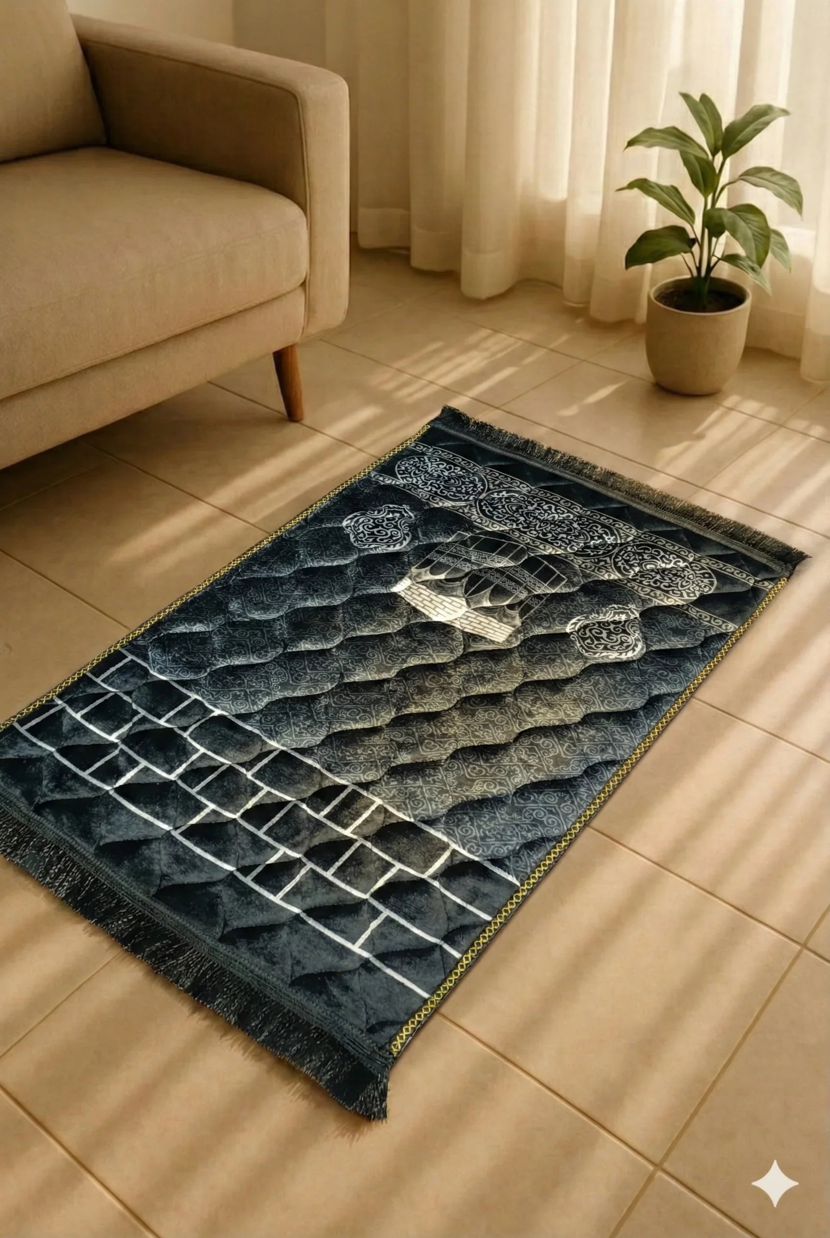 Dark blue Islamic prayer mat with mosque design on tiled floor, beige sofa, and potted plant nearby